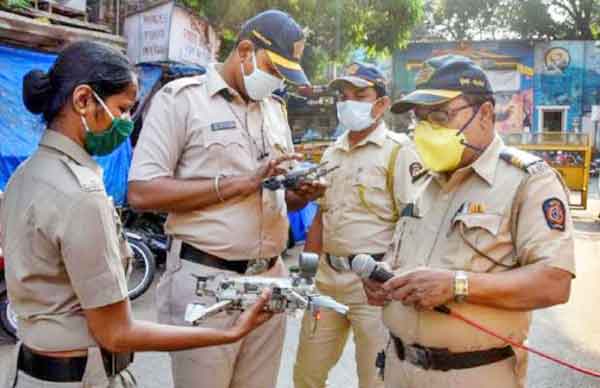 police group inspecting on drone